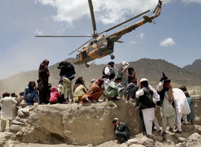 A Taliban helicopter takes off after bringing aid to the site of an earthquake in Gayan, Afghanistan. Reuters