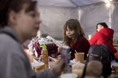 Refugees are provided with food in a tent at the Ukraine-Poland border. PA