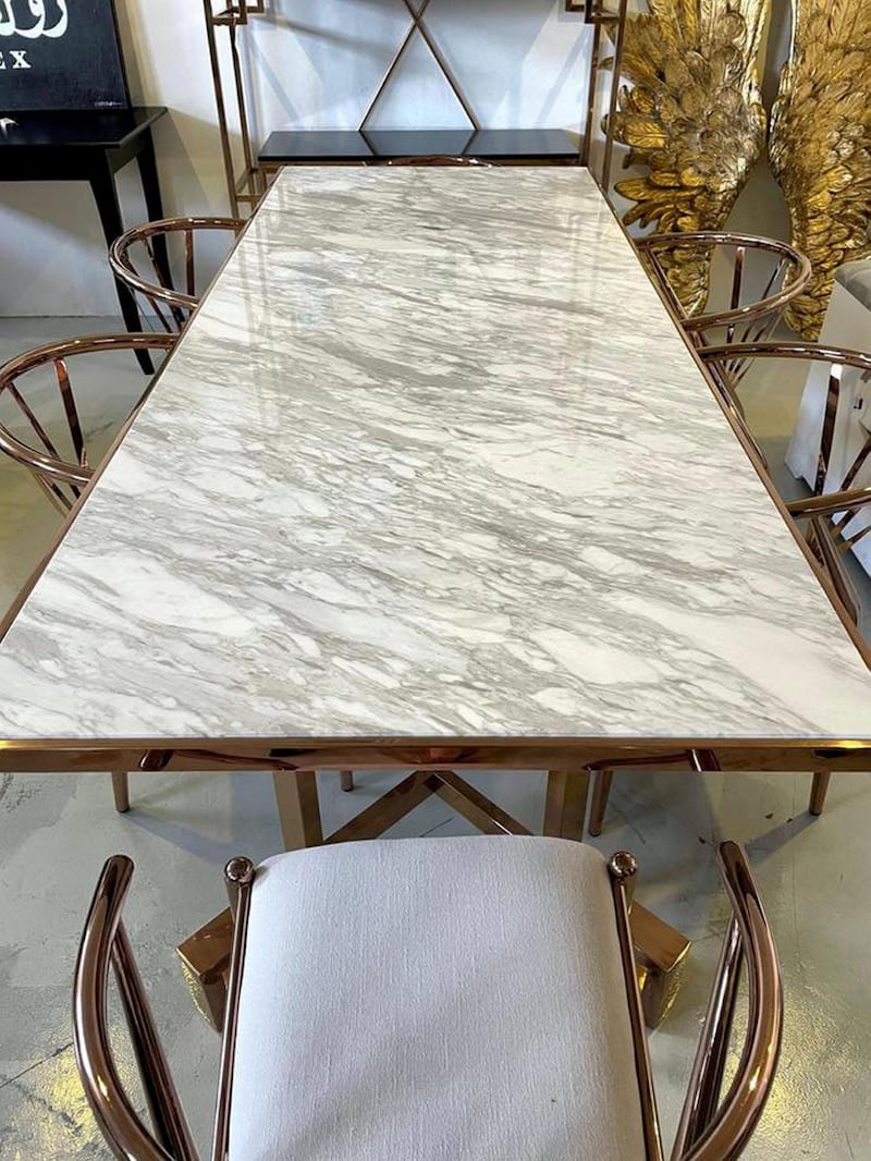 A second-hand marble dining table, with chairs from Kare, Dh5,000, at La Brocante.