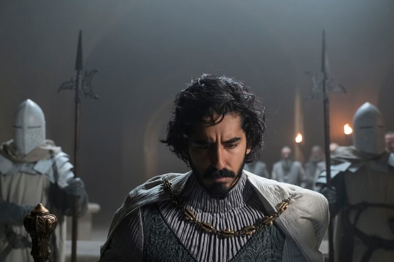 The epic fantasy film starring Dev Patel is written and directed by David Lowery. AP