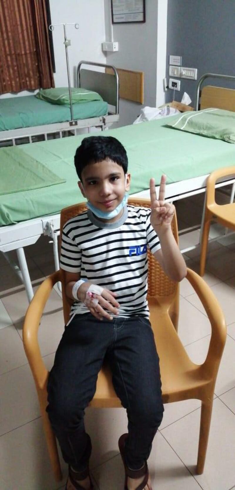 Mohamed Zishan is recovering from a head injury and is among more than 100 survivors of a plane crash in southern India. The nine-year-old was travelling from Dubai with his siblings and mother when an Air India Express aircraft crashed in Kozhikode, Kerala killing 18 passengers including two pilots. Courtesy: Sulfikar Ali