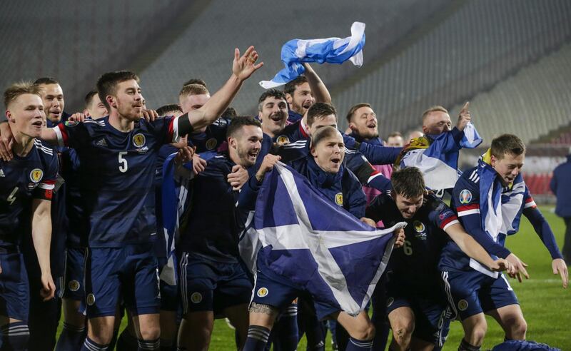 Scotland players celebrate after winning on penalties against Serbia in the Euro 2020 qualifier. EPA