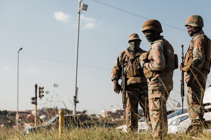 A member of the South African National Defence Force (SANDF) deployed outside the Phoenix Police Station in Phoenix township, north of Durban.