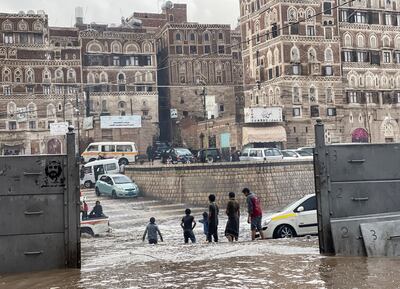 Boys play on a flood road in the old quarter of Sanaa, Yemen, on Monday. Reuters