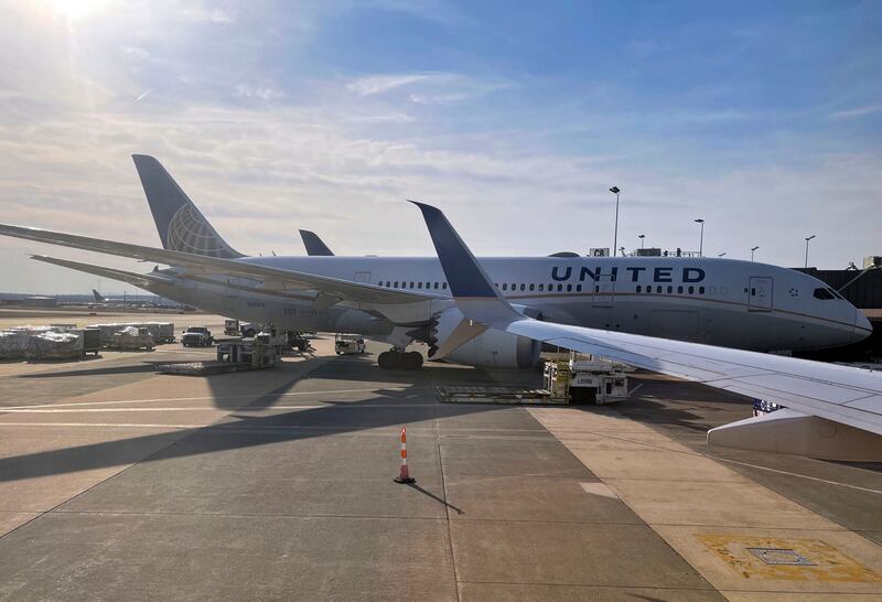 A United Airlines plane at Washington Dulles International Airport. A man has been arrested after opening an emergency exit of a jet operated by the airline and walking on to the wing as it taxied. AFP