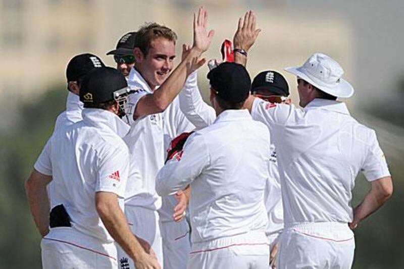 Stuart Broad celebrates dismissing Kyle Coetzer in the tour match in Dubai.