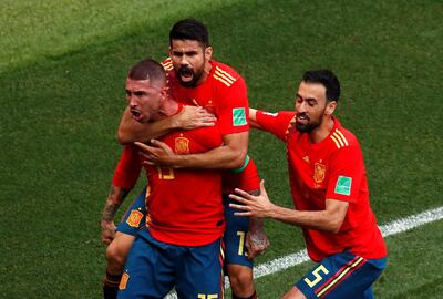 Soccer Football - World Cup - Round of 16 - Spain vs Russia - Luzhniki Stadium, Moscow, Russia - July 1, 2018  Spain's Sergio Ramos celebrates scoring their first goal with teammates  REUTERS/Maxim Shemetov