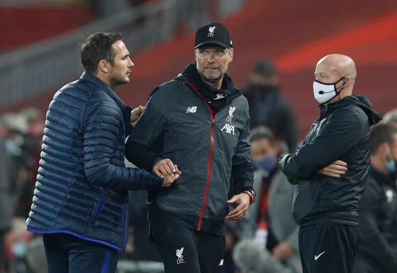 Soccer Football - Premier League - Liverpool v Chelsea - Anfield, Liverpool, Britain - July 22, 2020 Liverpool manager Juergen Klopp shakes hands with Chelsea manager Frank Lampard after the match, as play resumes behind closed doors following the outbreak of the coronavirus disease (COVID-19) Pool via REUTERS/Phil Noble EDITORIAL USE ONLY. No use with unauthorized audio, video, data, fixture lists, club/league logos or 'live' services. Online in-match use limited to 75 images, no video emulation. No use in betting, games or single club/league/player publications.  Please contact your account representative for further details.