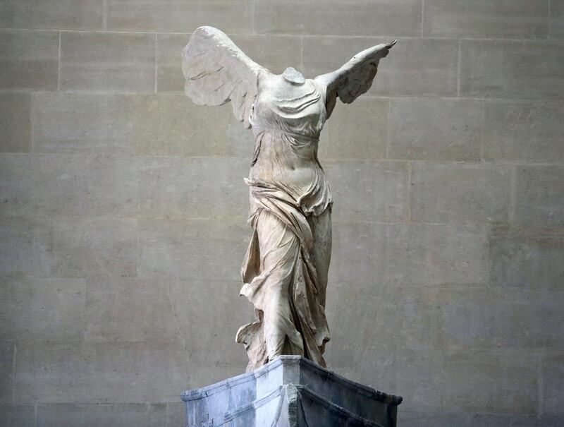 The Victory of Samothrace sculpture, after is was reinstalled at the top of the Daru staircase, at the Louvre museum in Paris on Thursday July 10, 2014. The 2,200-year-old,  29-ton statue, is back after almost a year of restoration.  The Victory of Samothrace is one of the five most popular works at the Louvre Museum, which attracts almost 10 million visitors a year. AP