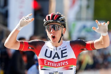 Tadej Pogacar of UAE Team Emirates celebrates as he crosses the finish line to win the 107th edition of the Liege-Bastogne-Liege one day cycling race in Liege, Belgium. EPA