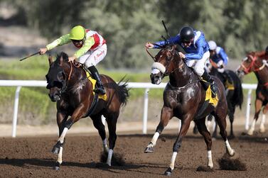 Connor Beasley and Night Castle, left, win the Al Shafar Investment race at Jebel Ali. Chris Whiteoak / The National