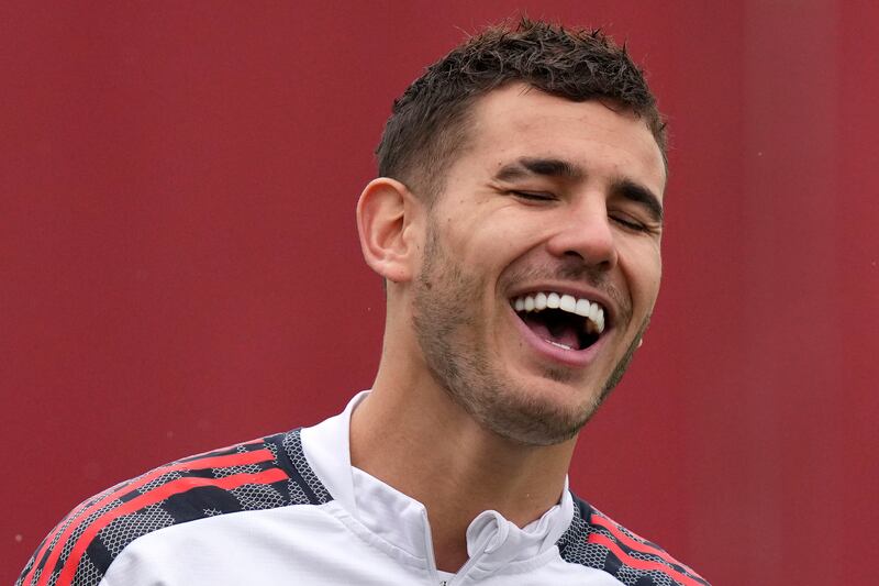 FC Bayern Munich's Lucas Hernandez laughs during a training session in Munich, Germany, Tuesday, Oct.  19, 2021.  Bayern will face Portuguese team Benfica in Lisbon for a Champions League group E soccer match on Wednesday, Oct.  20, 2021.  (AP Photo / Matthias Schrader)