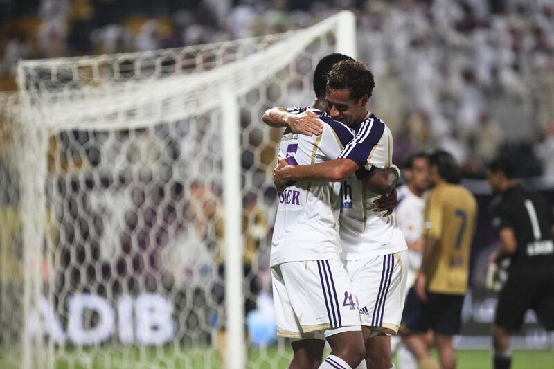 Dubai, UAE, October 10, 2012:

Al Ain went into Dubai's home stadium and properly dismantled the team. After ending the first half 1-1 Al Ain came back to win 4-1. THe tide was turned after a player from the Dubai club received a red card on a goal kick.

Al Ain's Nasser (left) and Brosque (right) hug after the their team's 3rd goal of the night.

Lee Hoagland/The National