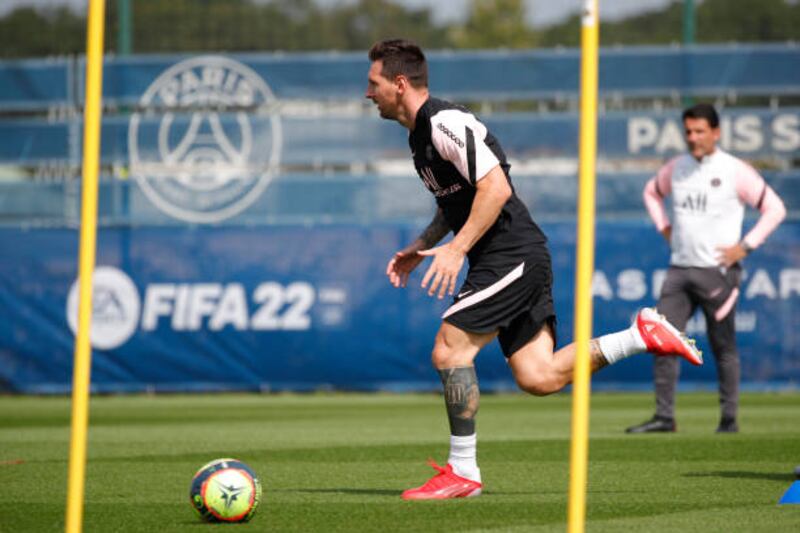 Lionel Messi warms up during a Paris Saint-Germain training session at Ooredoo Centre.