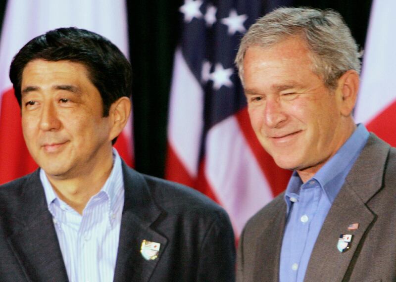 Japanese Prime Minister Shinzo Abe, left, and President George W Bush, right, attend a joint news conference at Camp David in 2006. AP Photo