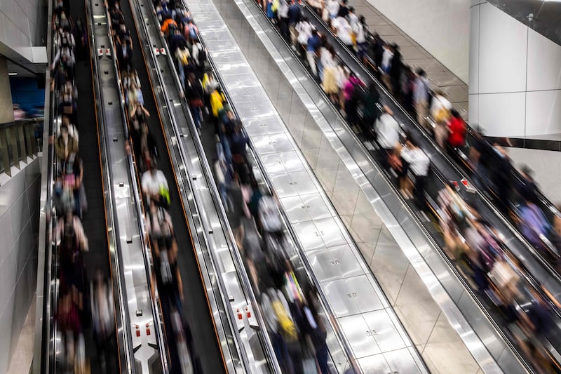 Commuters at a train station in Hong Kong. AFP