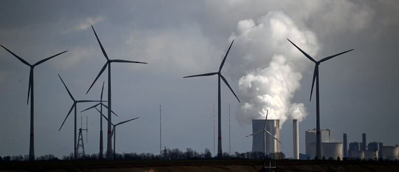 Wind turbines are seen near the coal-fired power station Garzweiler, western Germany. AFP