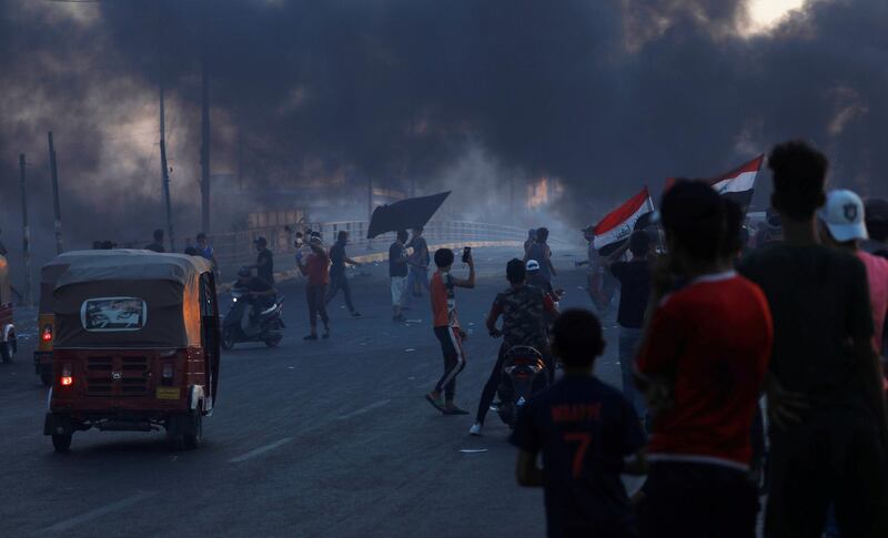 Young tuk-tuk drivers wait to carry wounded protesters to transfer them to hospitals during anti-government protests in Baghdad, Iraq. REUTERS