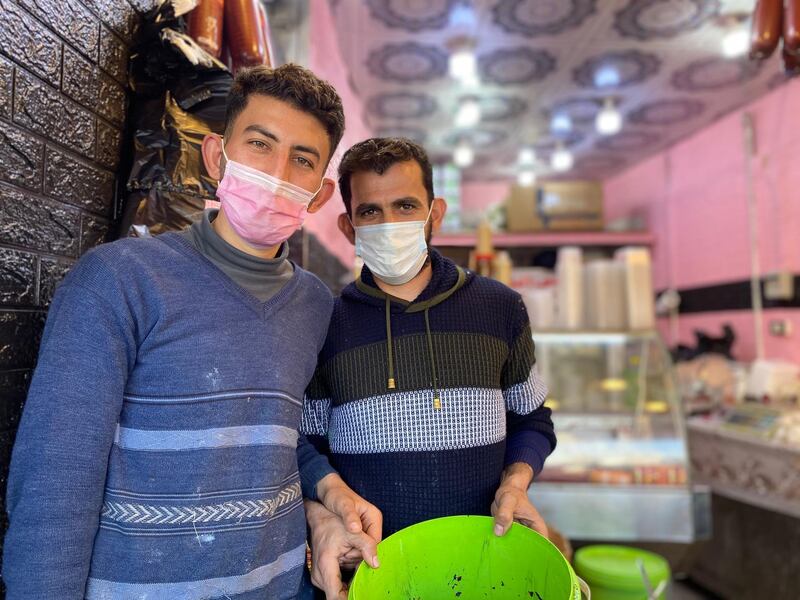 Workers at Raghadan market wear protective facemarks. Amy McConaghy / The National