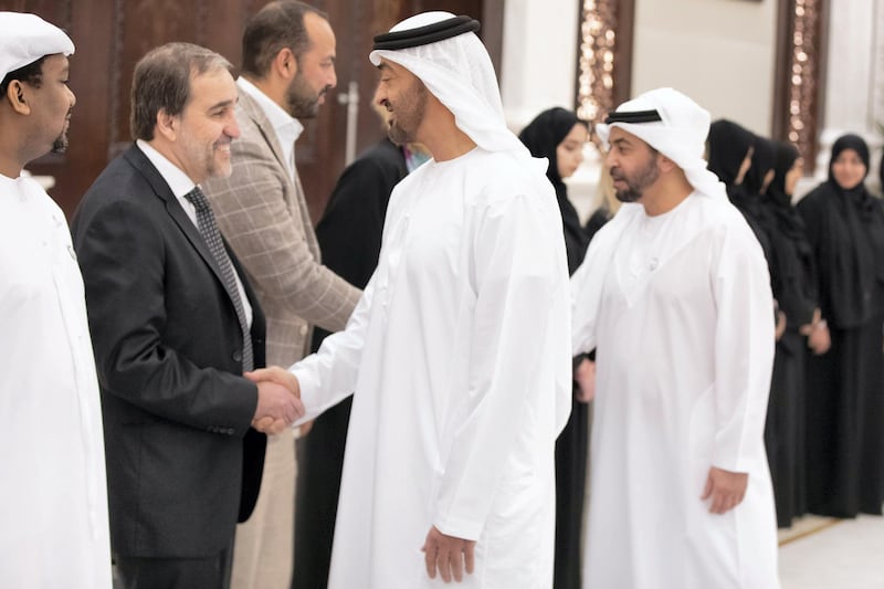 ABU DHABI, UNITED ARAB EMIRATES - May 14, 2019: HH Sheikh Mohamed bin Zayed Al Nahyan, Crown Prince of Abu Dhabi and Deputy Supreme Commander of the UAE Armed Forces (R), greets a doctor who volunteered at the Special Olympics World Games Abu Dhabi 2019, during an after reception at Al Bateen Palace. Seen with HH Sheikh Hamdan bin Zayed Al Nahyan, Ruler’s Representative in Al Dhafra Region (back). 

( Hamad Al Mansouri for the Ministry of Presidential Affairs )​
---