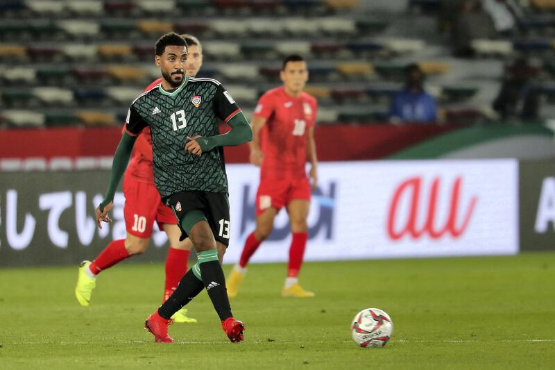 ABU DHABI , UNITED ARAB EMIRATES , January 21 – 2019 :- Khamis Esmaeel Zayed ( no 13 in green ) in action during the AFC Asian Cup UAE 2019 football match between UNITED ARAB EMIRATES vs. KYRGYZ REPUBLIC held at Zayed Sports City in Abu Dhabi. ( Pawan Singh / The National ) For News/Sports