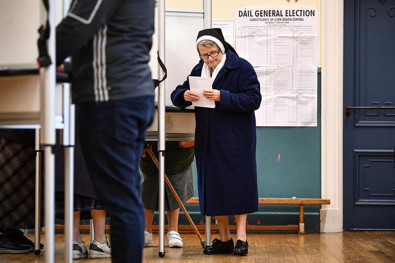 A nun casts her vote at Nano Nagle Hall in Irelands national election in Cork, Ireland. Getty Images