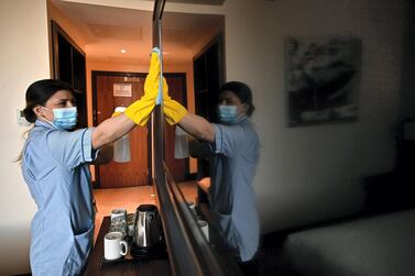 Staff members prepare the St Giles Hotel near Heathrow Airport for quarantining travellers. AFP