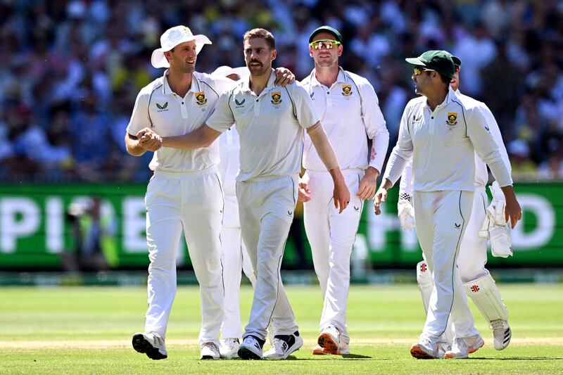 Anrich Nortje is congratulated by teammates after running out Australia batsman Marnus Labuschagne. AFP