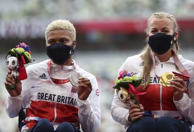 Hannah Cockroft and Kare Adenegan with their medals. PA