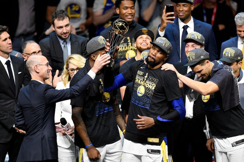 Golden State Warriors forward Kevin Durant  receives the Bill Russell NBA Finals Most Valuable Player Award from NBA Commissioner Adam Silver. David Richard / Reuters