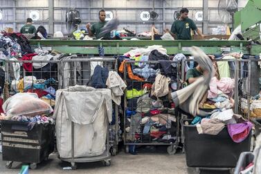 Thousands of tonnes of clothes are recycled and sent to countries in Africa. Antonie Robertson / The National
