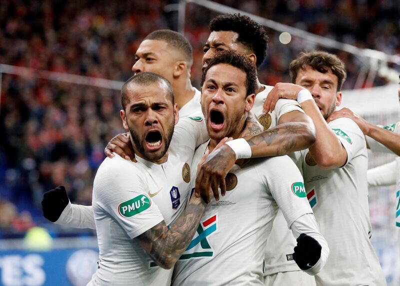 Dani Alves celebrates scoring Paris Saint-Germain's first goal with Neymar and other teammates in the French Cup final against Rennes. Charles Platiau / Reuters