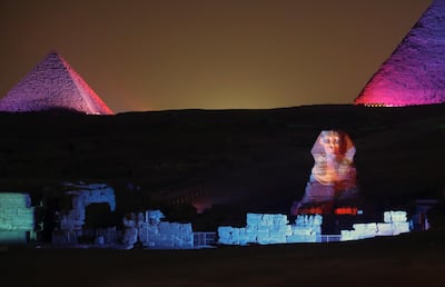 The Sphinx is lit up in front of the Great Pyramids during the sound and light show at the Giza Pyramids plateau. EPA