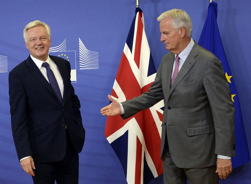 British Secretary of State for Exiting the European Union (Brexit Minister) David Davis (L) is welcomed by European Union Chief Negotiator in charge of Brexit negotiations with Britain Michel Barnier prior to their meeting at the European Union Commission headquarter in Brussels, July 17, 2017.

 / AFP PHOTO / THIERRY CHARLIER