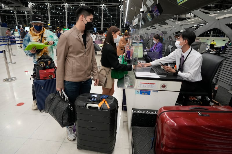 Thai travellers check in for their trip to Osaka and Tokyo, at Suvarnabhumi International Airport in Samut Prakan province, Thailand. AP Photo