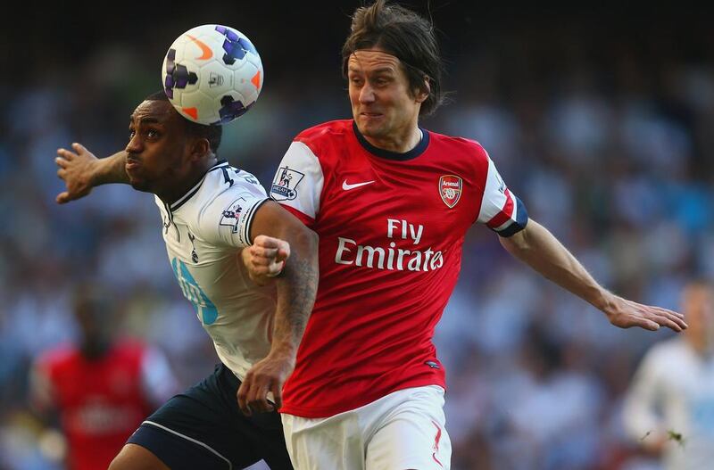 Danny Rose of Tottenham Hotspur and Tomas Rosicky of Arsenal battle for the ball during their English Premier League match at White Hart Lane on March 16, 2014 in London, England. Rosicky's goal 72 seconds from the start and that proved enough for Arsenal to leave with three points. Paul Gilham / Getty Images

