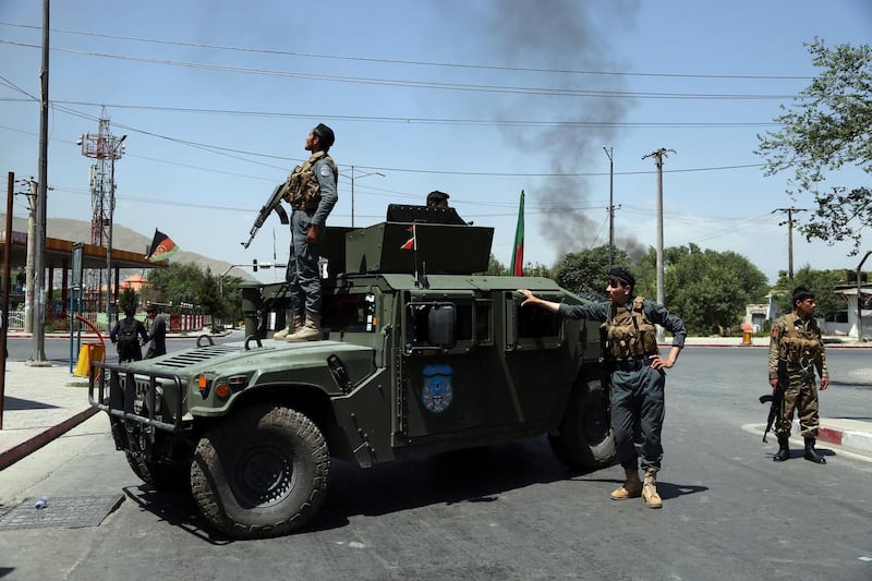 Afghan security forces arrive at the site of an explosion in Kabul, Afghanistan, Monday, July 1, 2019. A powerful bomb blast rocked the Afghan capital early Monday, rattling windows, sending smoke billowing from Kabul's downtown area and wounding dozens of people. (AP Photo/Rahmat Gul)