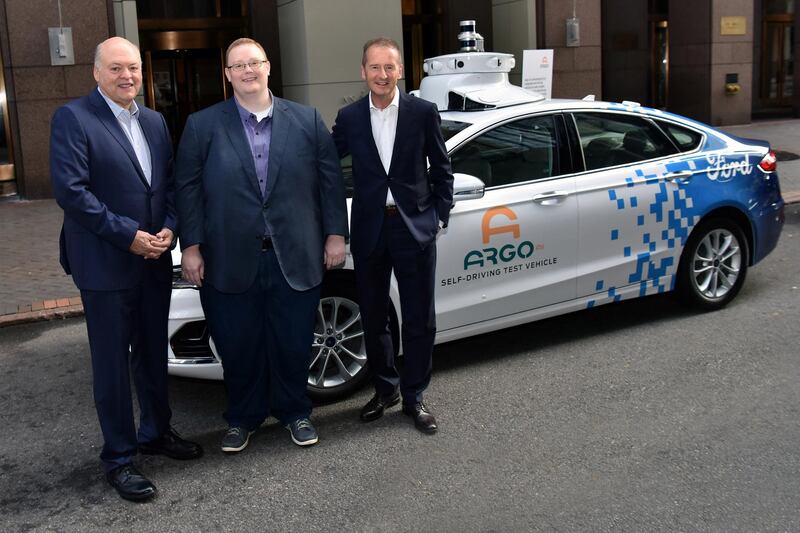 Ford President and CEO Jim Hackett, Argo AI co-founder Bryan Salesky and VW CEO Herbert Diess appear with a prototype vehicle after announcing a joint investment in Argo, a self-driving autonomous vehicle company in New York City, New York, U.S. July 12, 2019.   Sam VarnHagen/Handout via REUTERS      ATTENTION EDITORS - THIS IMAGE WAS PROVIDED BY A THIRD PARTY. NO RESALES. NO ARCHIVE.
