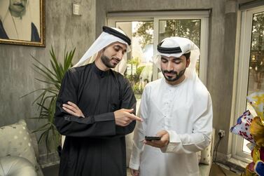 Hesham Alkhazraji and Yousif Almaazmi co-founded an app with Bassam Elshorafa (not pictured) to keep in touch after they returned from university in the US. Antonie Robertson / The National