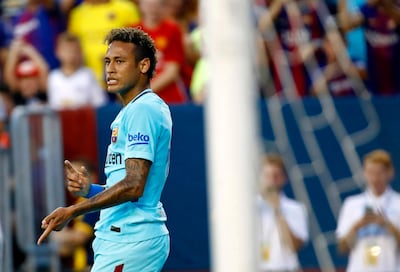 Barcelona's Neymar gestures after scoring a goal during the first half of an International Champions Cup soccer match against the Manchester United, Wednesday, July 26, 2017, in Landover, Md. (AP Photo/Patrick Semansky)