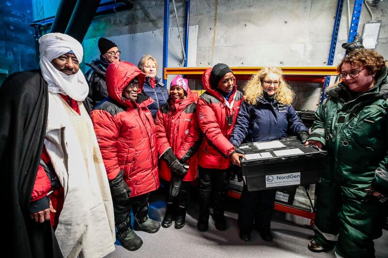 Norway's Prime Minister Erna Solberg and Agriculture and Food Minister Olaug Bollestad with Ghanaian President Nanna Addo Dankwa Akufo-Addo as they present seeds to be stored at the Svalbard's global seed vault in Longyearbyen, Norway. NTB scanpix via AP