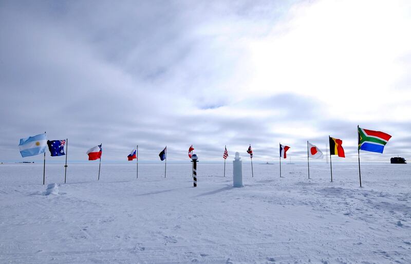 F3T6RR Flags of original signatory nations of the Antarctic Treaty at the South Pole, Antarctica. Image shot 01/2012. Exact date unknown.