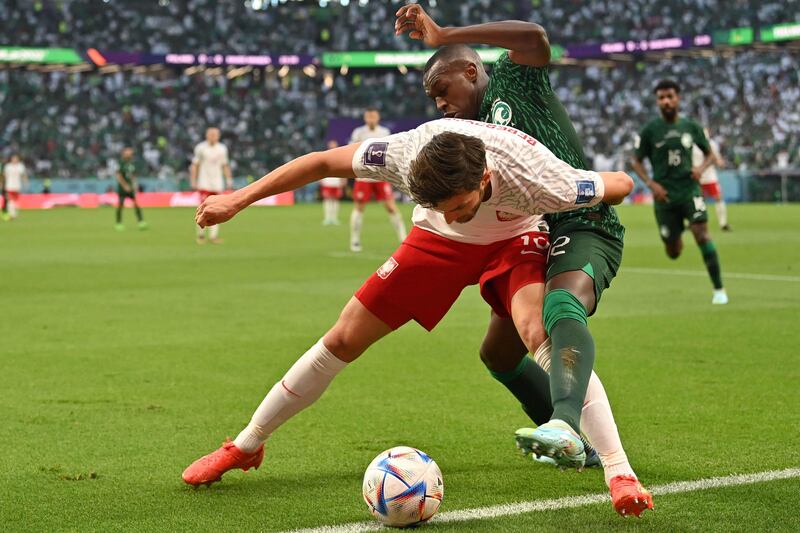 Poland's Bartosz Bereszynski battles with Saudi Arabia's Abdulhamid. AFP