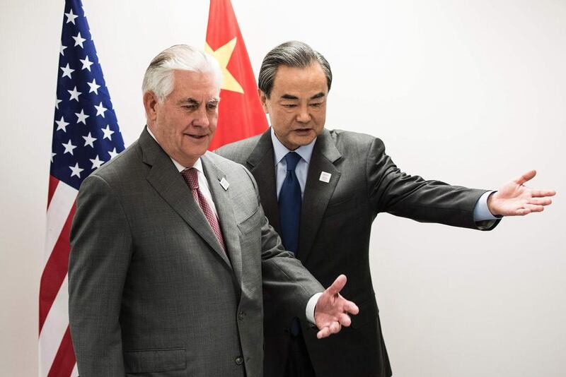 US secretary of state Rex Tillerson and China’s foreign minister Wang Yi take their seats before a meeting on the sidelines of a gathering of G20 foreign ministers in Bonn, Germany on February 17, 2017. Brendan Smialowski / AFP