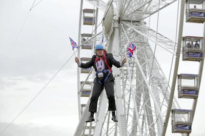 ***STOCK FILE IMAGE***LONDON, UNITED KINGDOM - AUGUST 01: Mayor of London Boris Johnson got stuck on a zip-line during BT London Live in Victoria Park on August 01, 2012 in London, England.

London Mayor Boris Johnson has proved he is ready to put his body on the line for a successful 2012 Olympics - but he might have gone too far in his latest stunt after getting stuck on a zip-line in Victoria Park. Mr Johnson was a guest at a BT London Live event at the east London park, where visitors can watch the Games action on a big screen or try their hand at a range of Olympic sports. But the mayor quickly became a major talking point on Twitter after pictures taken by people at the park surfaced of him dangling awkwardly from the wire, while brandishing a couple of Union flags. Several pictures showed Mr Johnson hanging from a harness wearing a blue helmet while waving the flags, although it is uncertain whether he was intending to stop where he did - or if it was a true zip-line malfunction. Earlier this week a poll of Conservative voters suggested the mayor was their top choice to succeed David Cameron as prime minister. He has so far enjoyed a high-profile Games, kicked off by addressing 60,000 people in Hyde Park on the day of the opening ceremony by taunting Republican presidential nominee Mitt Romney over his comments apparently doubting London's readiness to host.

PHOTOGRAPH BY Barcroft Media

UK Office, London.
T +44 845 370 2233
W www.barcroftmedia.com

USA Office, New York City.
T +1 212 796 2458
W www.barcroftusa.com

Indian Office, Delhi.
T +91 11 4053 2429
W www.barcroftindia.comPHOTOGRAPH BY  / Barcroft Media 

London-T:+44 207 033 1031 E:hello@barcroftmedia.com -
New York-T:+1 212 796 2458 E:hello@barcroftusa.com -
New Delhi-T:+91 11 4053 2429 E:hello@barcroftindia.com www.barcroftmedia.com (Photo credit should read Barcroft Media / Barcroft Media via Getty Images)