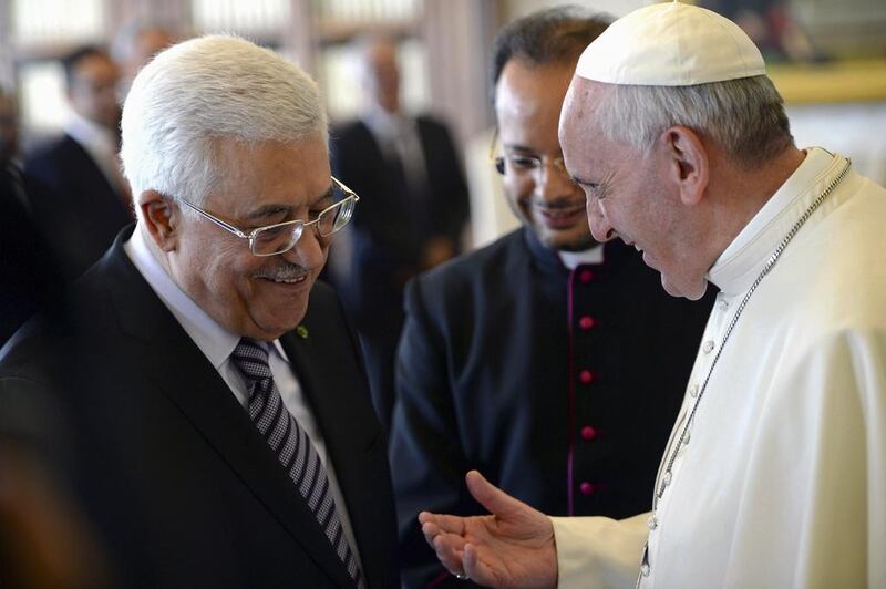 Pope Francis talks to Palestinian President Mahmoud Abbas during a private audience in the pontiff library at the Vatican.  Maurizio Brambatti/Pool via Reuters 
