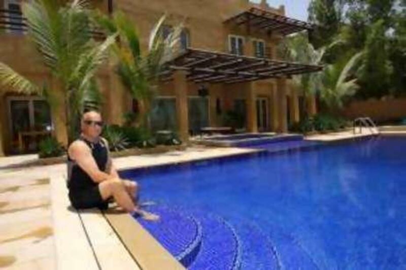 Dubai, 24th June 2008.  Rod Smith beside his chlorine free swimming pool and jacuzzi, at his residence in The Lakes.  (Jeffrey E. Biteng / The National) *** Local Caption ***  JB0323-Rod.jpg