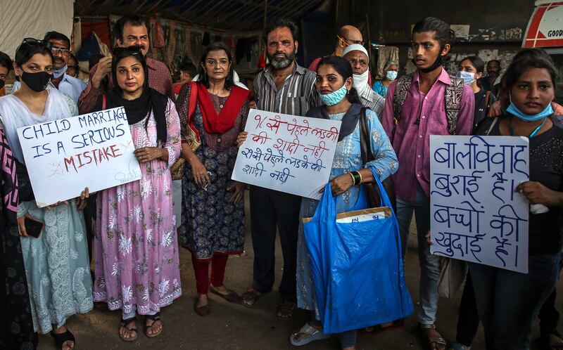 People hold placards as they protest over a gang-rape case in Mumbai, India, in September 2021. All photos: EPA
