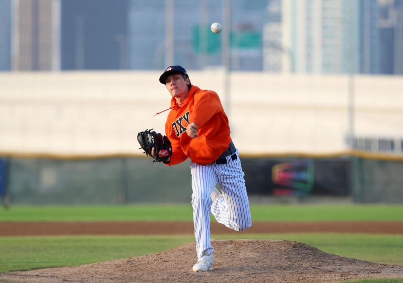 Dubai, United Arab Emirates - Reporter: Paul Radley. Sport. Baseball. Dubai Senior Baseball players (final year of school) have received offers to play baseball next season at university level in US and Canada. Ollie Duthie (blue) and Mattia Sparacino. Wednesday, March 24th, 2021. Dubai. Chris Whiteoak / The National