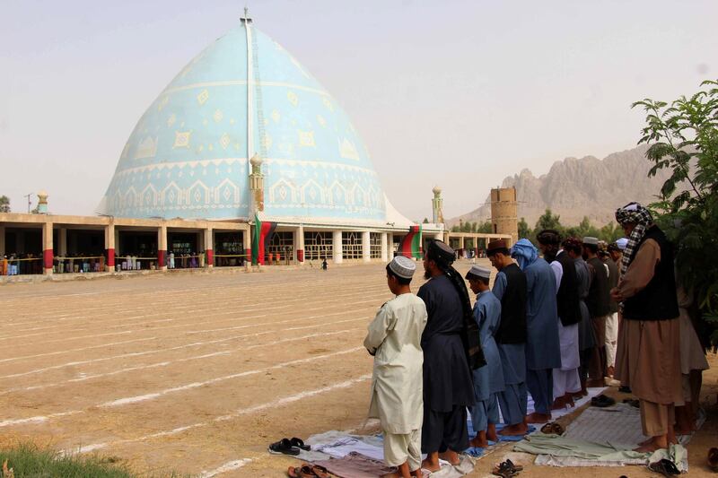 Afghans offer congregational prayers during the holy festival of Eid Al Adha, in Kandahar, Afghanistan.  EPA